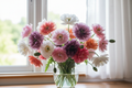 Papaver somniferum Angel Choir Mix — loose abundant vase of ruffled double poppies in pink, white, mauve, coral and hot pink with buds and seed pods, bright natural window light