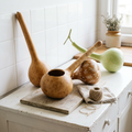 Long-necked dipper gourds displayed with decorative craft examples